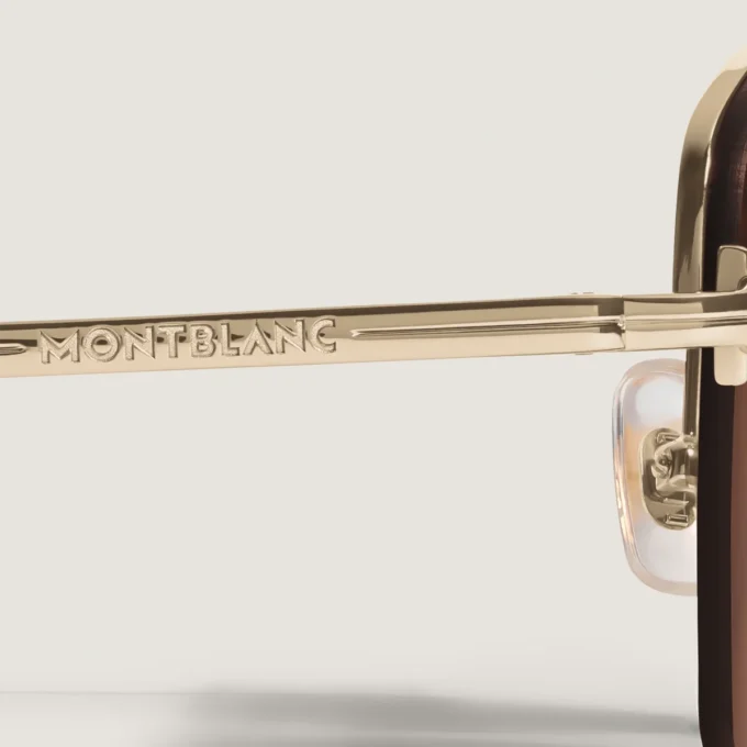 Ovale Sonnenbrille mit goldfarbenem Metallrahmen